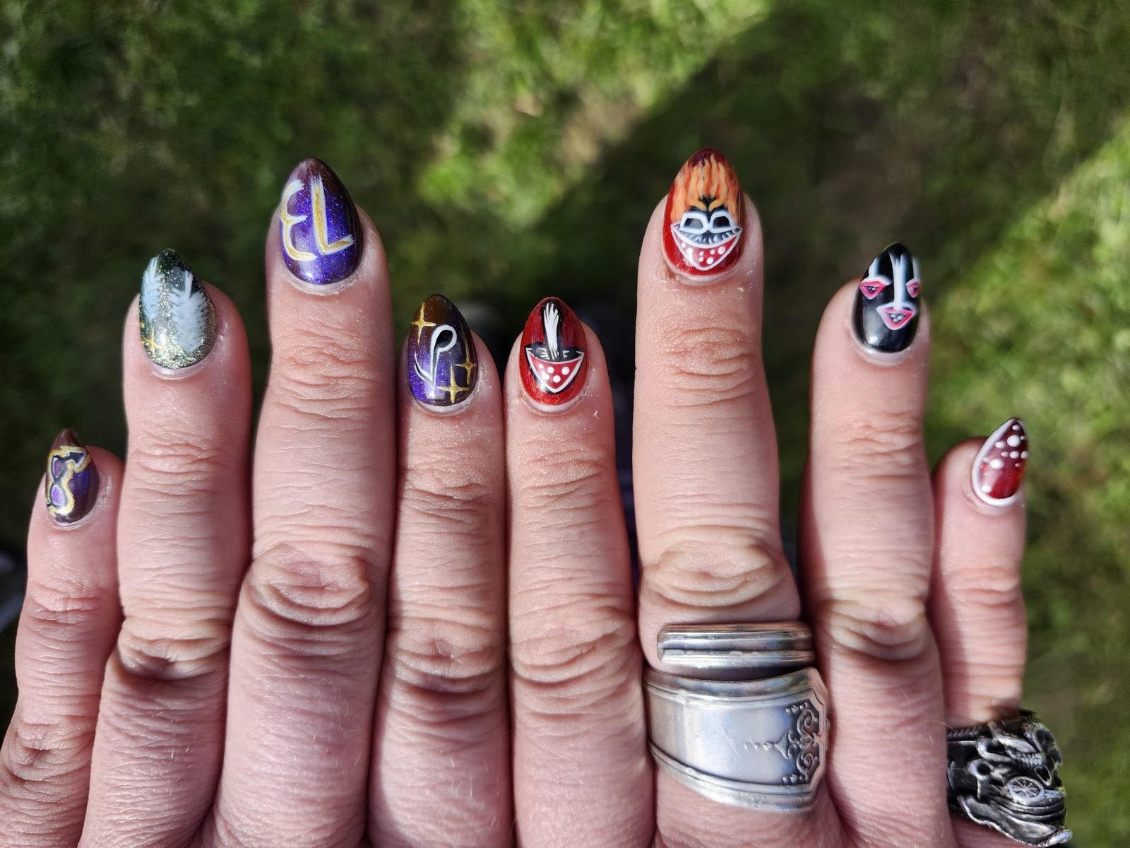 A hand with each nail painted for the festival