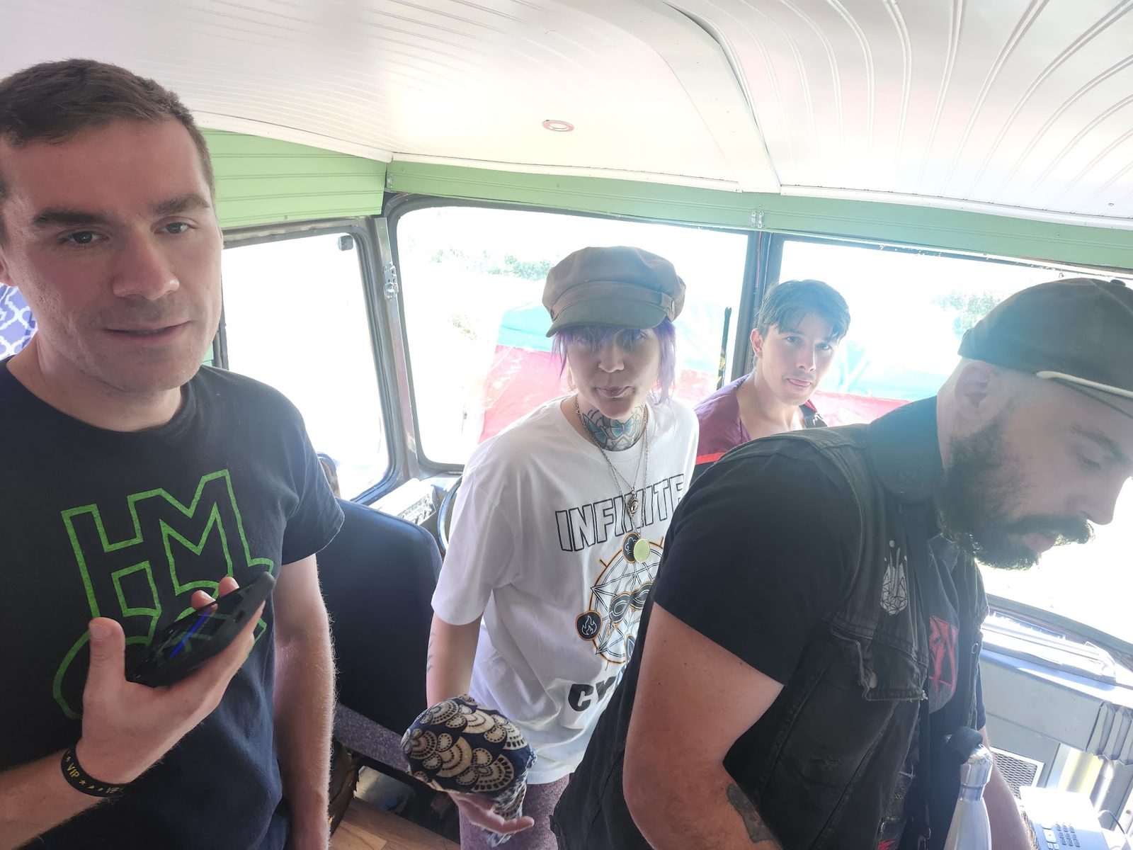 Inside the bus, crew talking before a set
