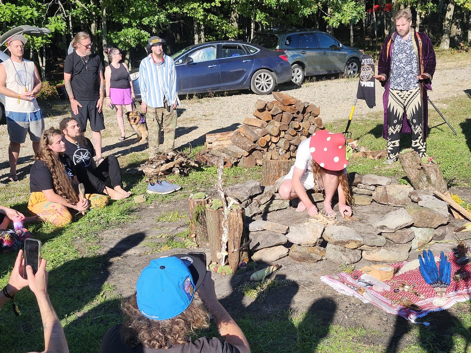 People gathered around the stone circle being built