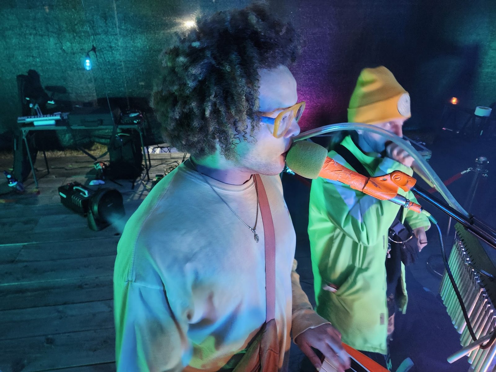 Two emcees trading bars on the night stage