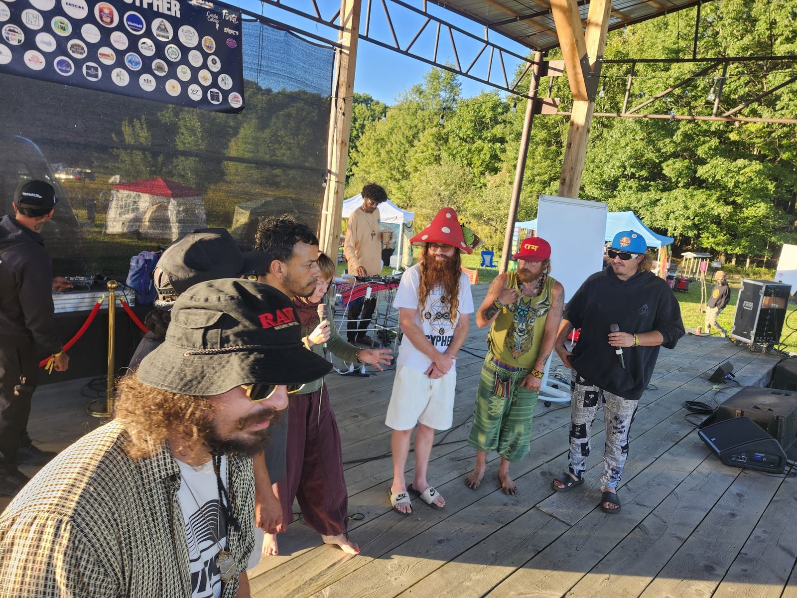 Artists and friends on the stage in daylight