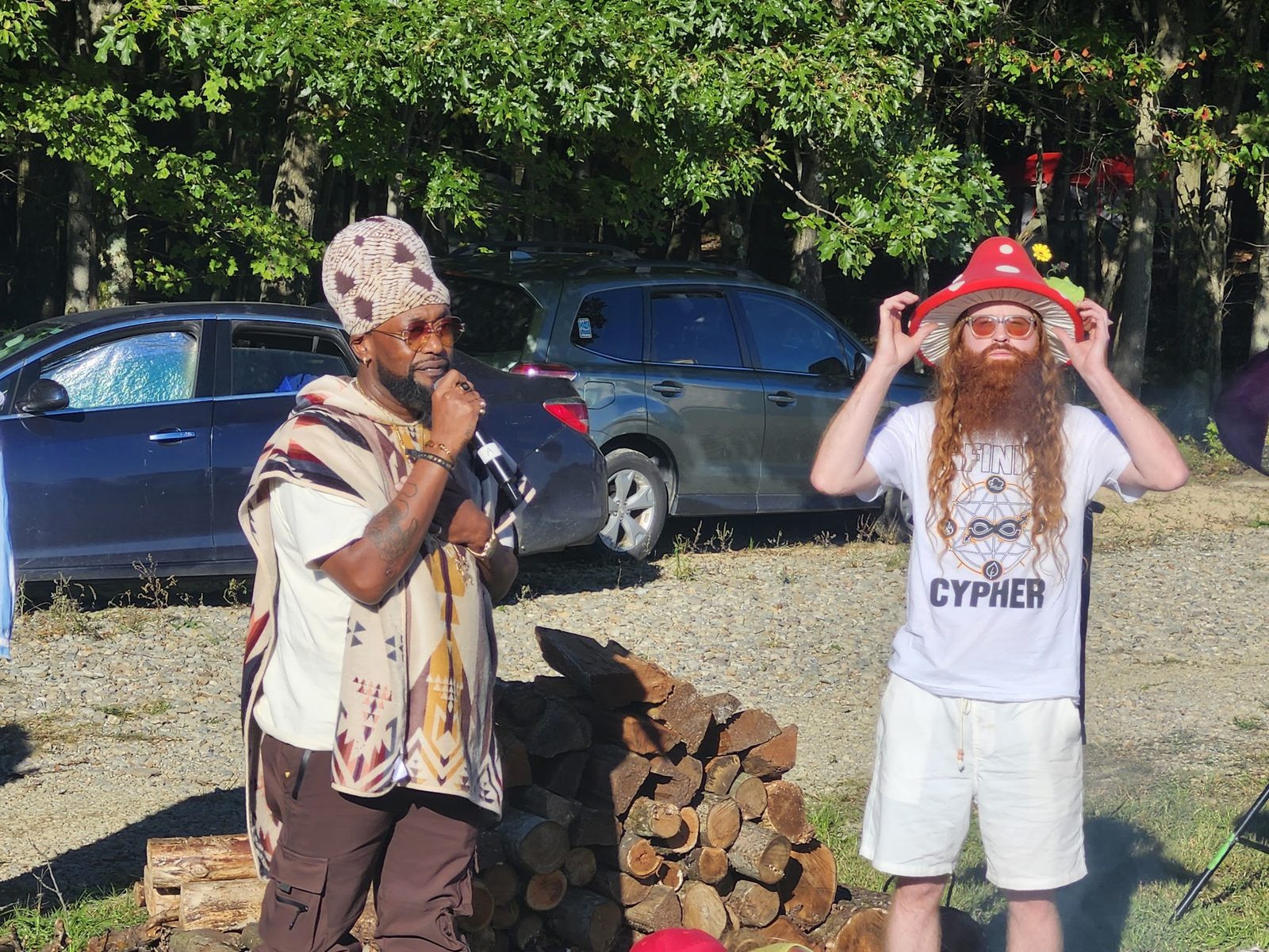Two artists by the woodpile between sets